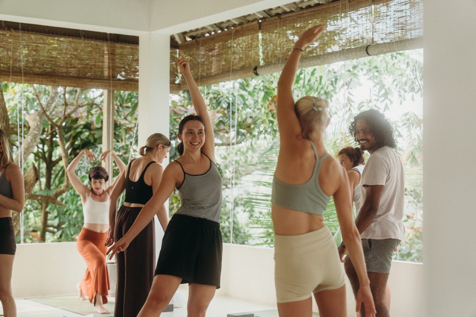 Trainees practising together in the open-air shala at Lanka Yoga, Sri Lanka
