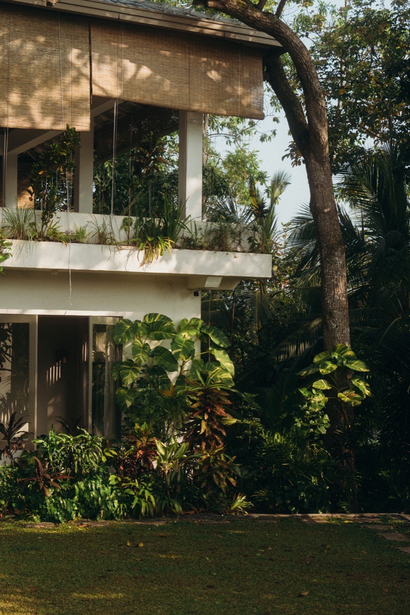Lakeside retreat accommodation surrounded by tropical garden at Lanka Yoga, Sri Lanka