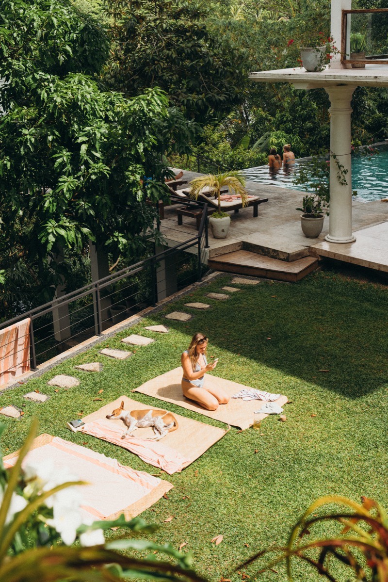 Relaxing by the pool on the garden lawn at a yoga retreat in Sri Lanka
