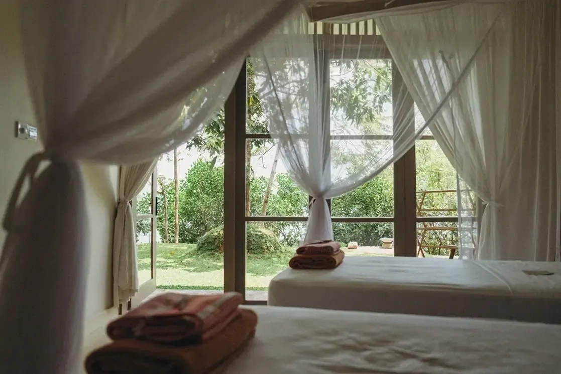 Twin share retreat room with lake views at Lanka Yoga